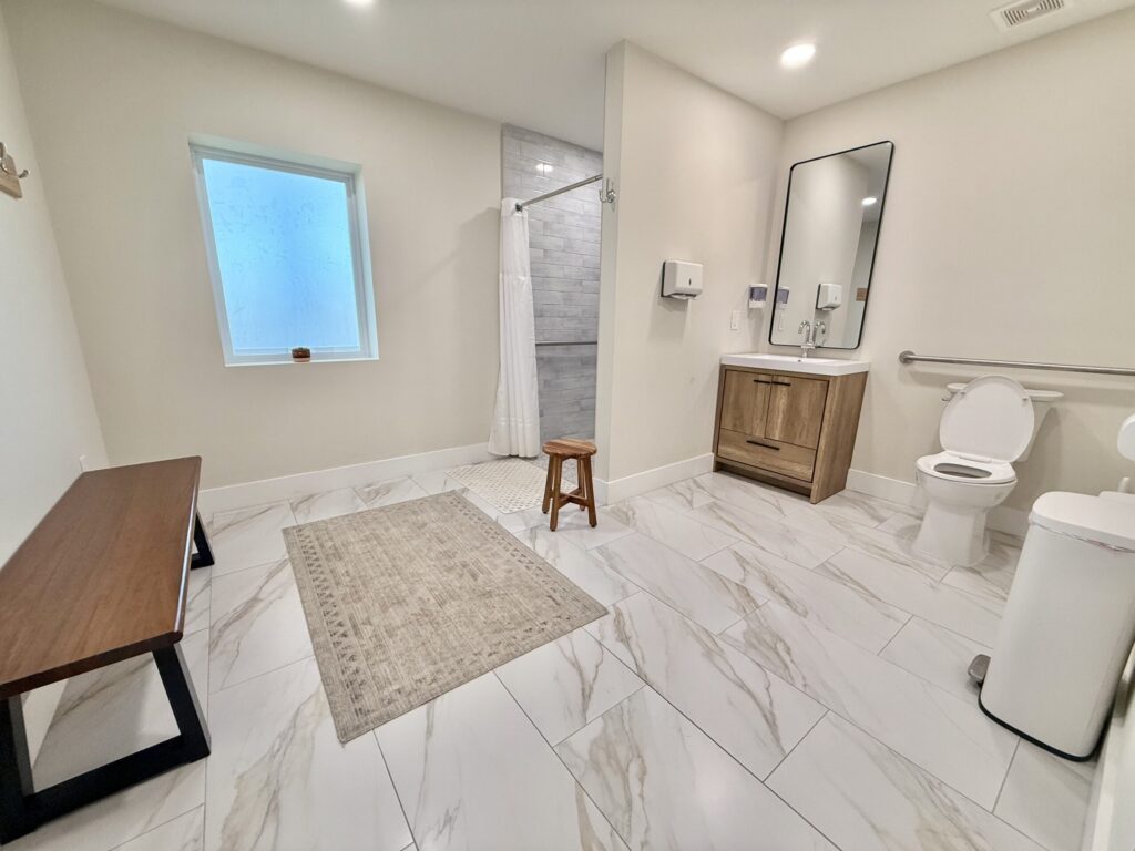 large bathroom with toilet and shower