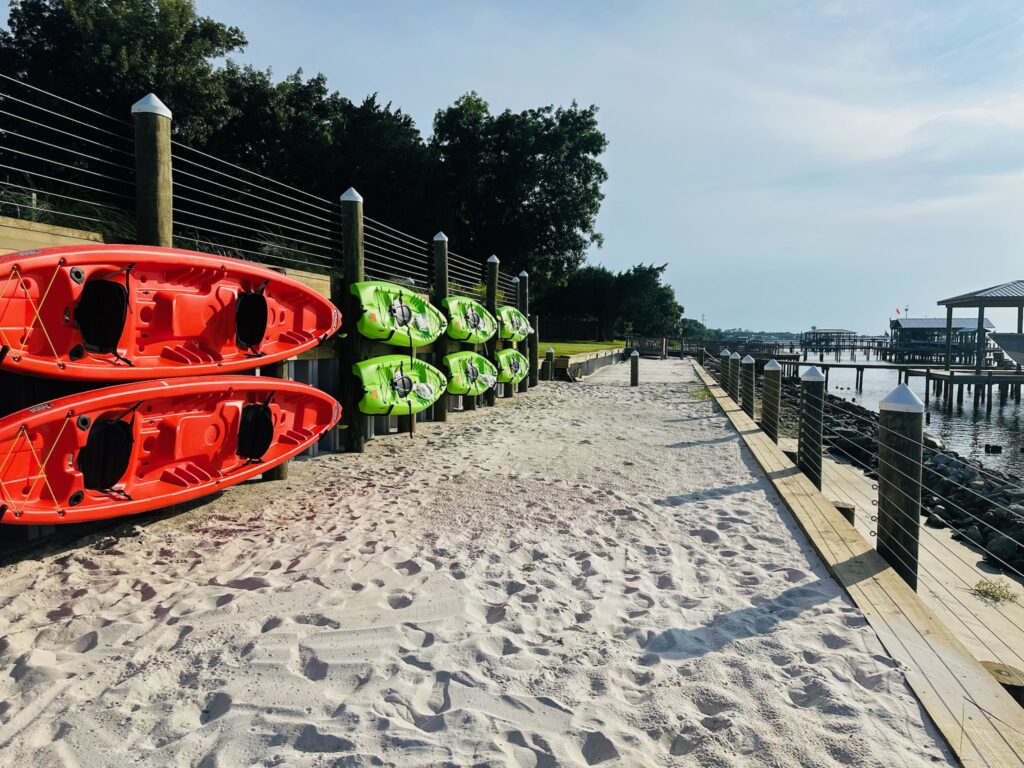 sandy beach with kayaks