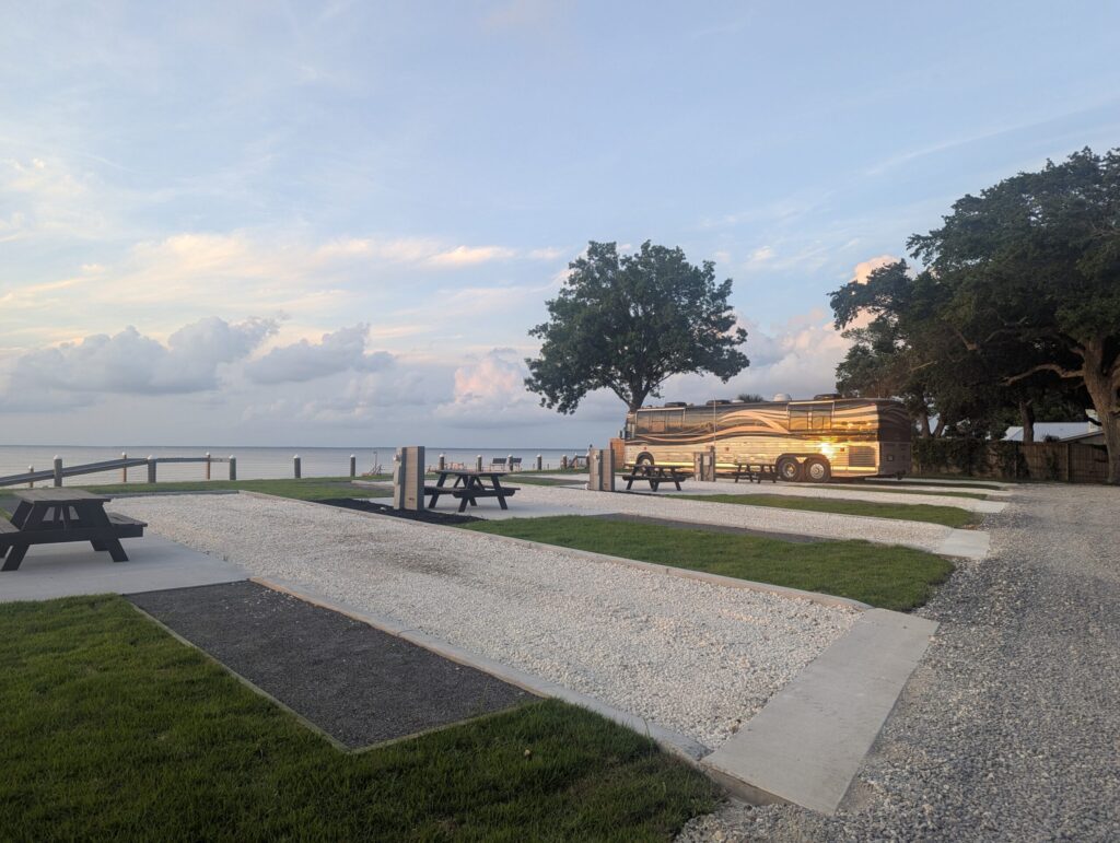 RV on waterfront site at Fort Morgan RV Park