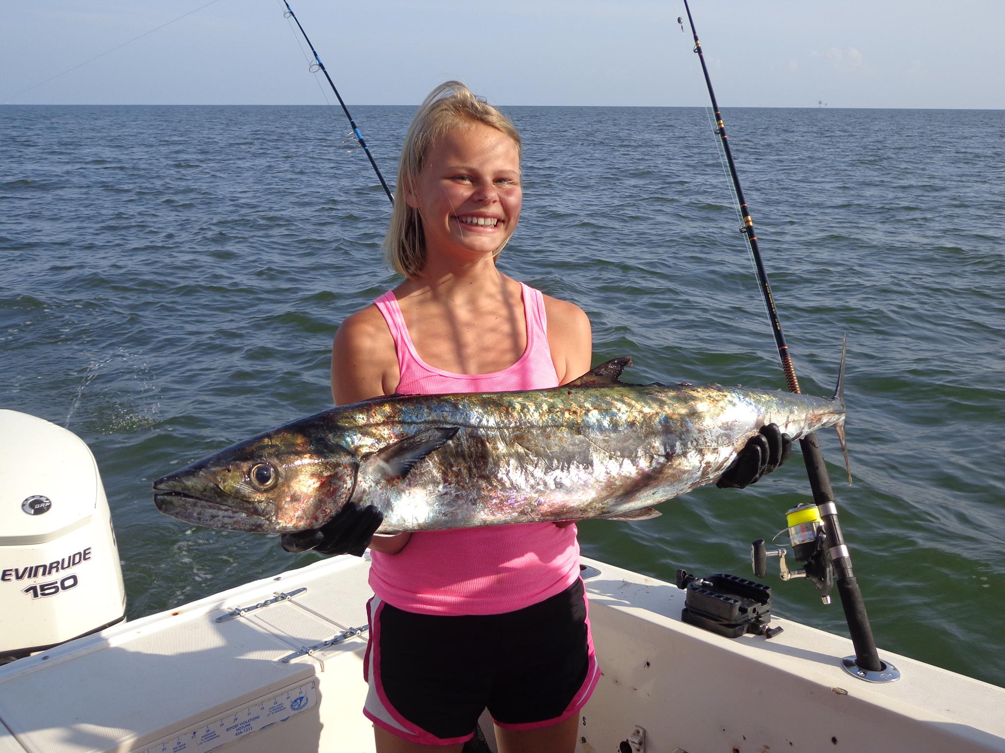 girl holding large fish